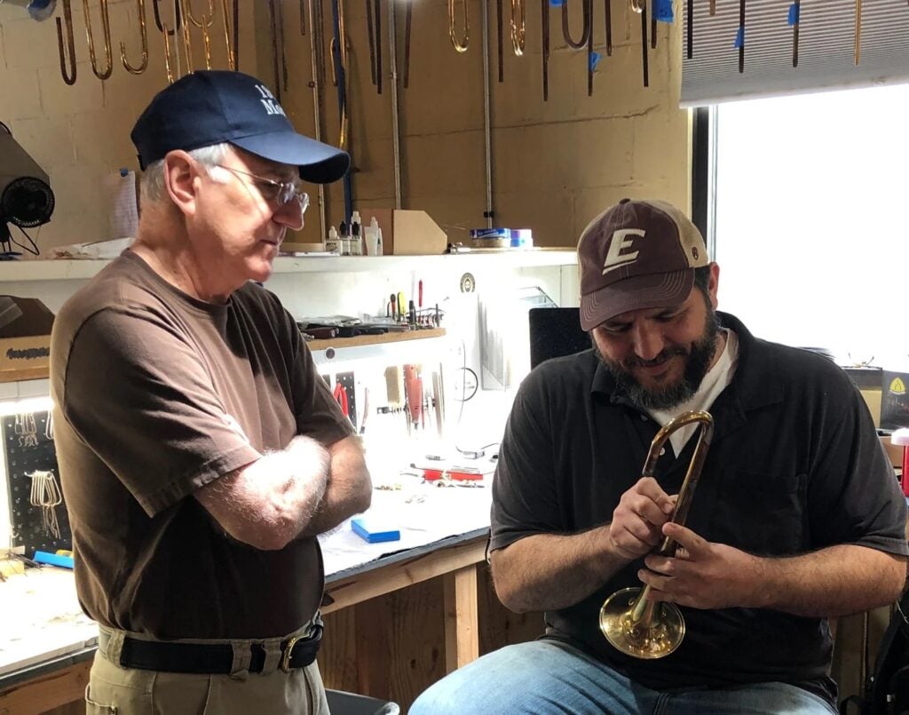 Cliff Blackburn overseeing trumpet maker