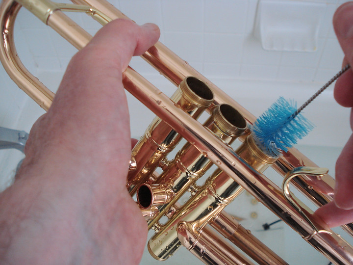 scrubbing a trumpet valve casing